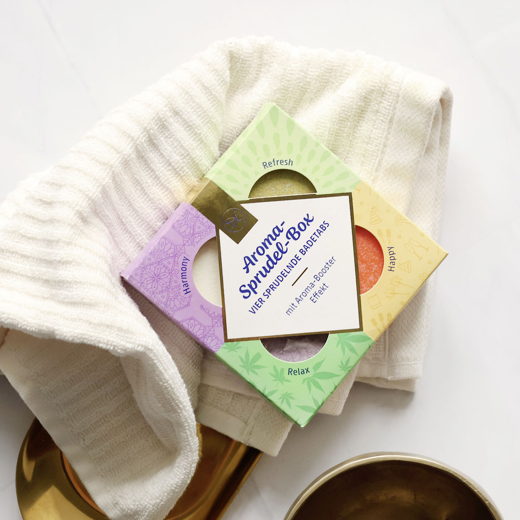 Aroma-Sprudelbox Geschenkset liegt auf einem weichen Handtuch