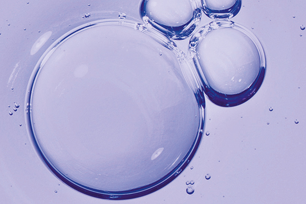 Moodbild zum Wirkstoff Retinol: violetter Hintergrund mit violetten Tropfen
